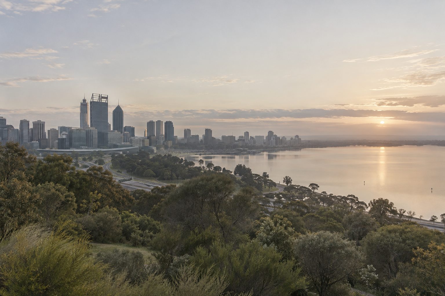 Perth city and the Swan River seen from Kings Park in soft early morning light.